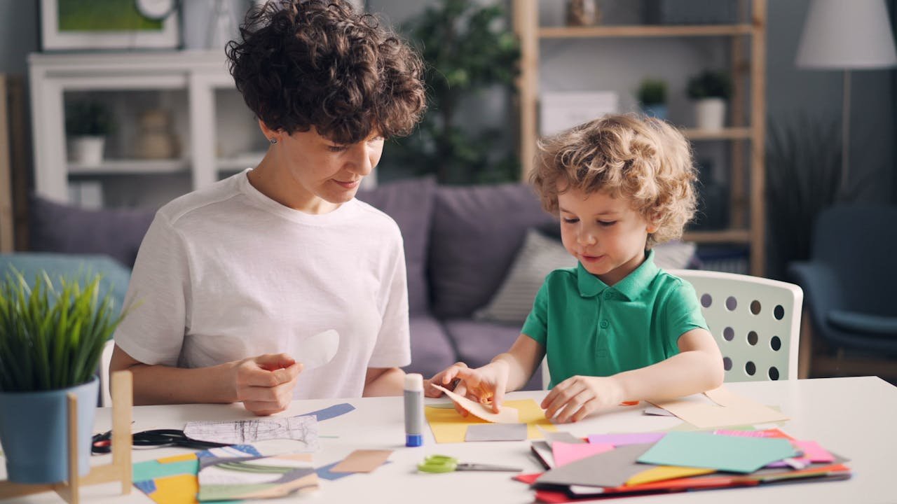 Offerings A mother and child enjoy a creative arts and crafts activity together at home.